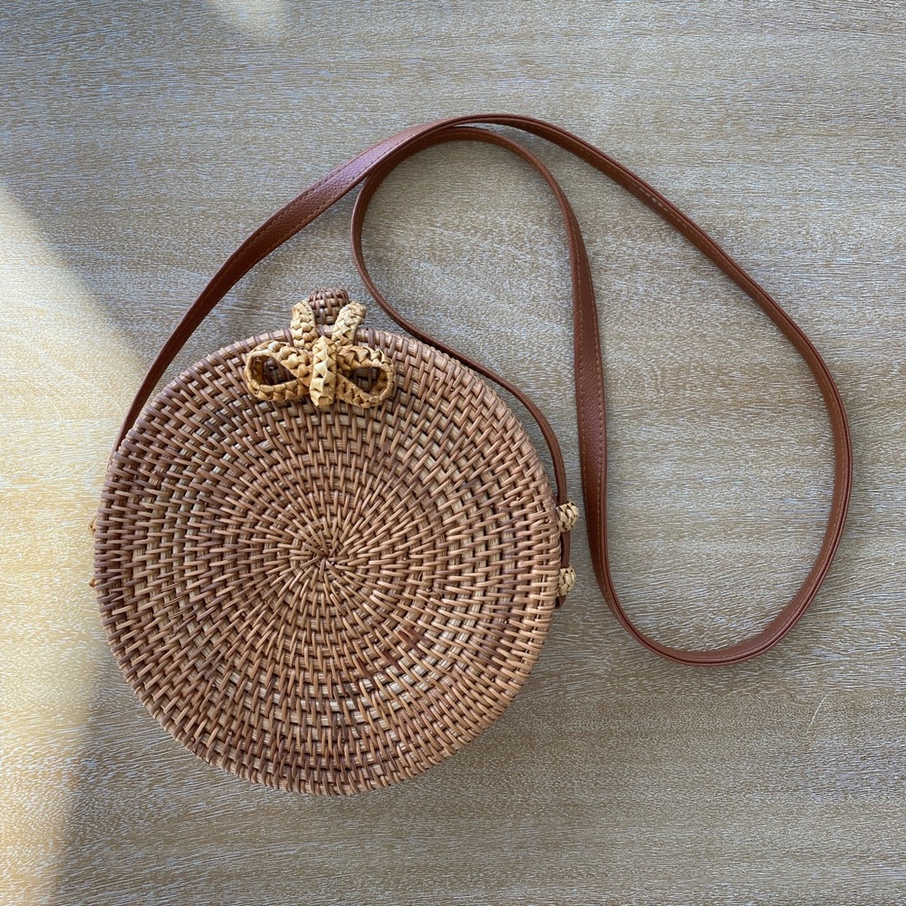 Rattan roundie round bag with cloth lining and leather strap